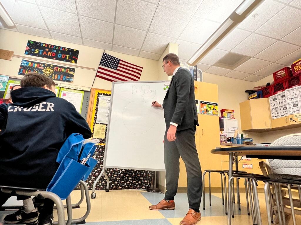 Matt Meyer teaching a class in a school room