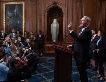 Speaker of the House Kevin McCarthy speaks at a podium.