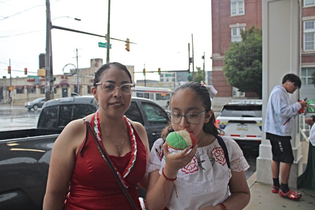 Reyna Casarez (left) organized the ''Desfile de Carros Alegóricos'' for the second year in a row. Shes says part of her motivation is to share the tradition with her daughter, Ellie