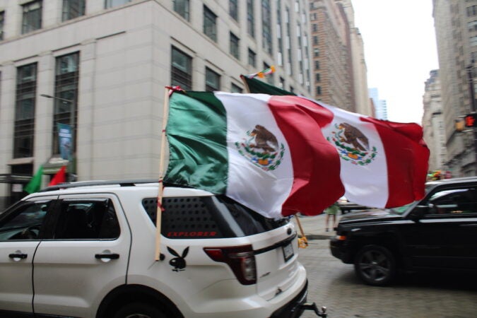 Cars decorated with the Mexican flag formed a parade through Philadelphia on Sept. 10, 2023, in celebration of Mexican Independence Day. (Emily Neil/WHYY)
