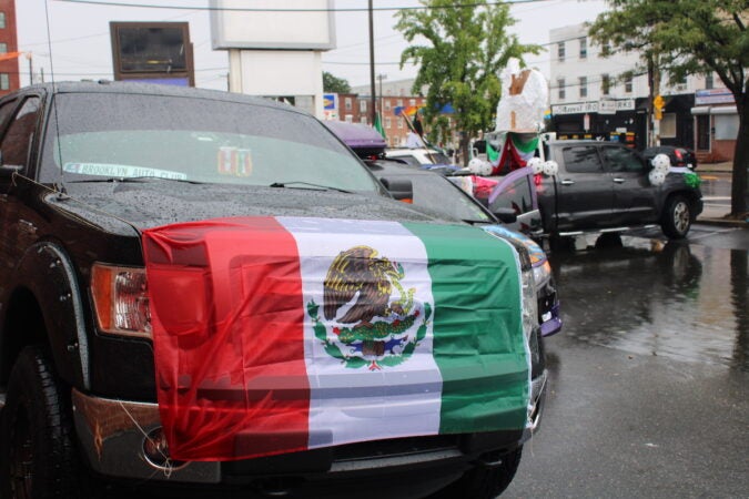 Cars decorated with the Mexican flag formed a parade through Philadelphia on Sept. 10, 2023, in celebration of Mexican Independence Day. (Emily Neil/WHYY)