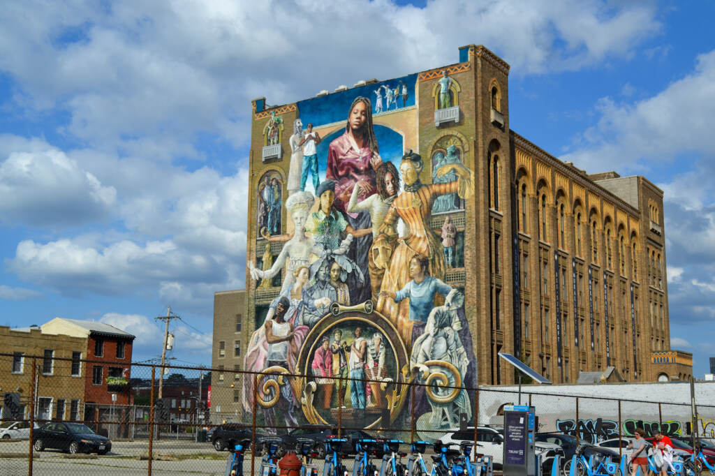 A large mural painted on the side of a building