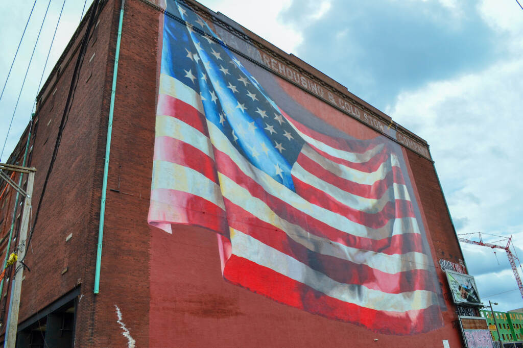 A large mural painted on the side of a building