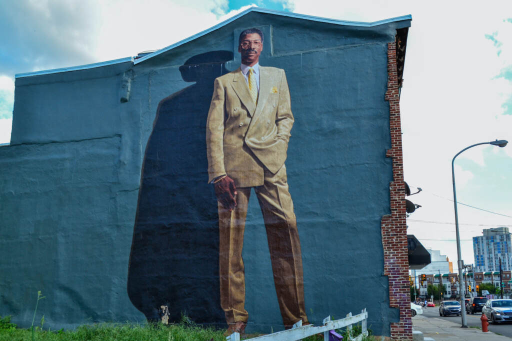 A large mural showing Dr. J on the side of a building