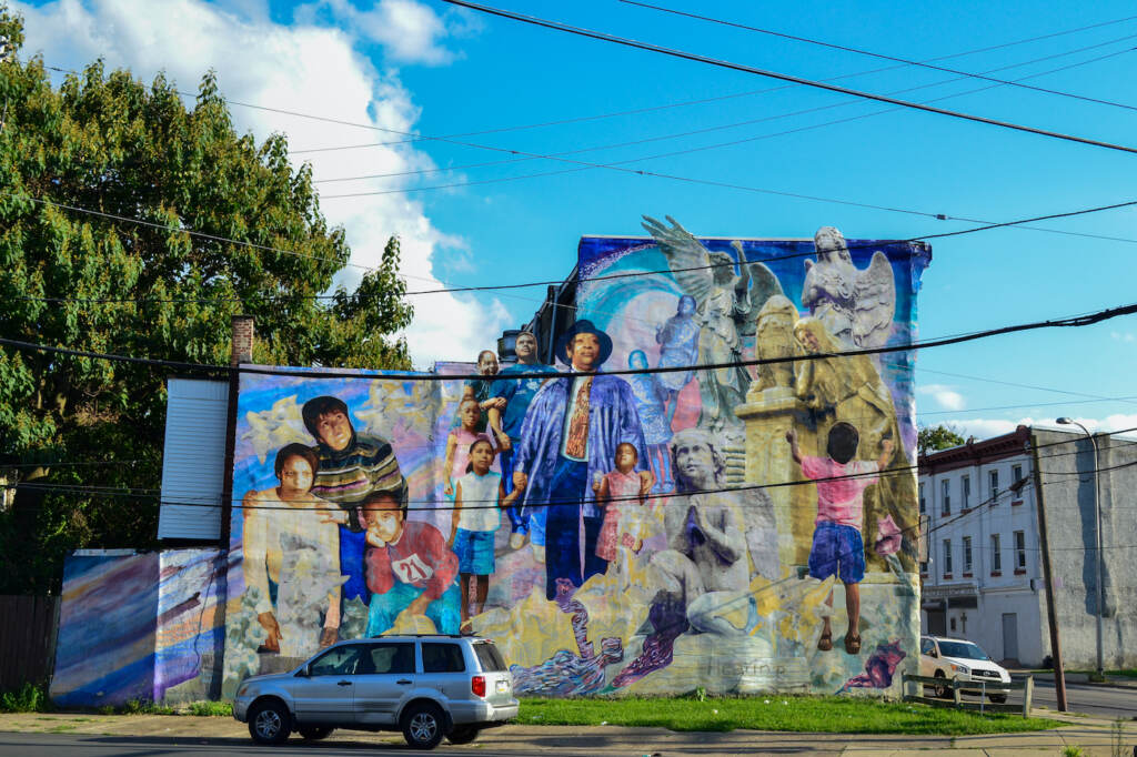 A large mural painted on the side of a building