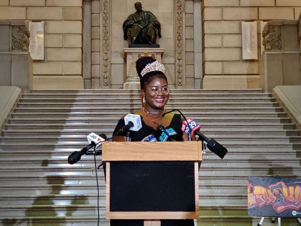 Oyewumi Oyeniyi at a podium