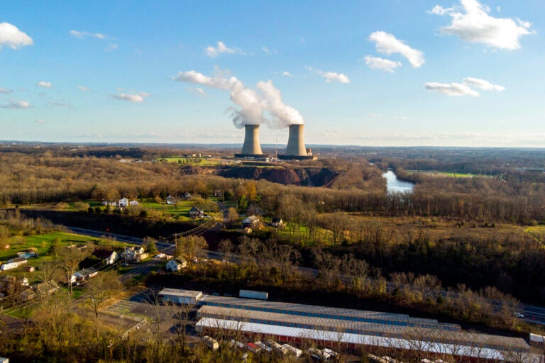 A power plant is seen in the distance.