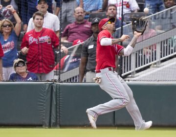 Phillies right fielder Nick Castellanos catches Orlando Arcia's fly ball and throws it home in the ninth inning of a baseball game against the Atlanta Braves, Wednesday, Sept. 20, 2023, in Atlanta.