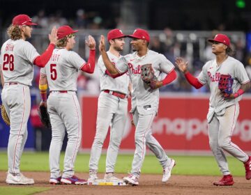 Members of the Philadelphia Phillies celebrate after the Phillies defeated the San Diego Padres 9-7 in a baseball game Monday, Sept. 4