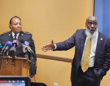 Sheriff Rochelle Bilal watches as First Deputy Tariq El-Shabazz speaks at a press conference.