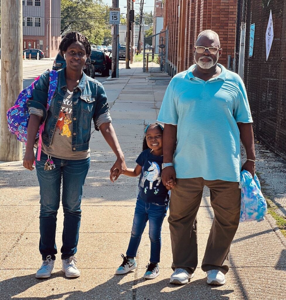 Venus James, left, with her daughter, center, and her father, Harold James, right.