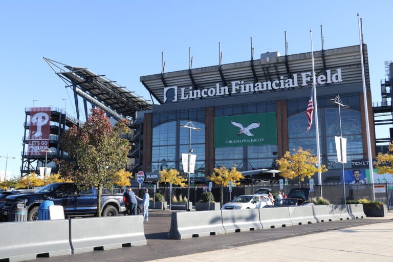 The Philadelphia Eagles home stadium, Lincoln Financial Field, has a banner rooting for their neighbors across the street. (Cory Sharber/WHYY)