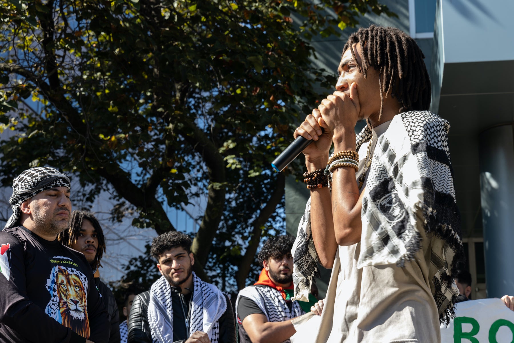 Indigo Jordan speaking into a microphone at the rally