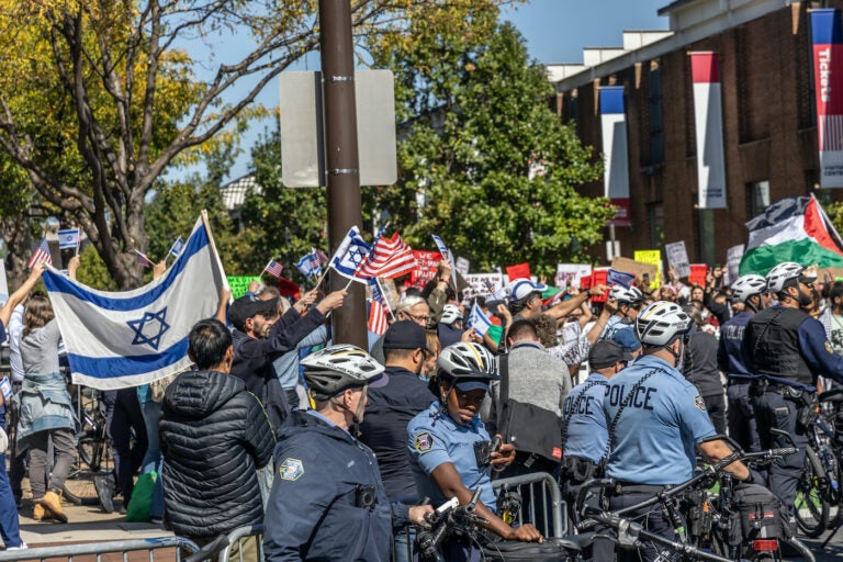 Police officers watch the rally