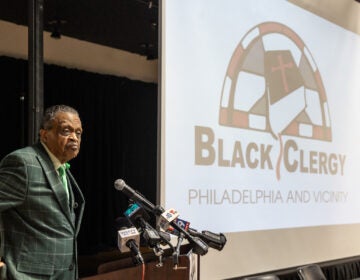 Rev. Robert Collier Sr. speaking at a podium