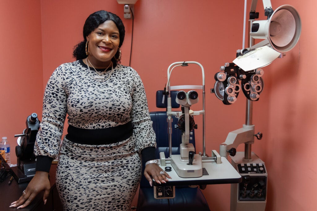 Lakeisha King Smith in an examination room with eye testing equipment.