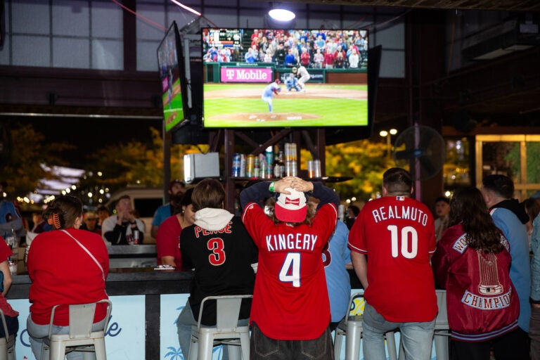 Fans watch as the Phillies clinch their spot in the NLCS, putting them one step closer to the World Series on October 12, 2023 (Emily Cohen for WHYY)