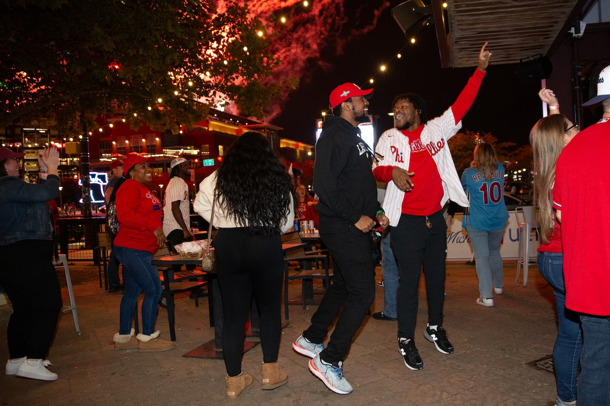 Fans celebrate as the Phillies clinch their spot in the NLCS, putting them one step closer to the World Series on October 12 2023 (Emily Cohen for WHYY)