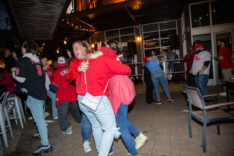 Fans celebrate as the Phillies clinch their spot in the NLCS, putting them one step closer to the World Series on October 12 2023 (Emily Cohen for WHYY)