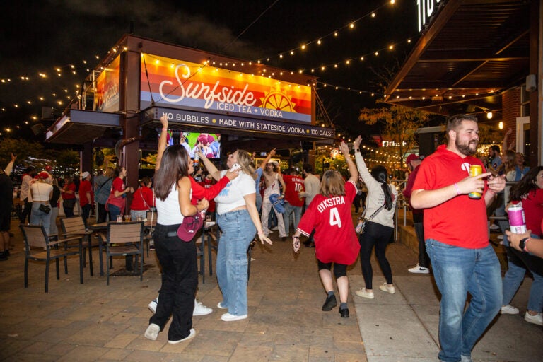 Fans celebrate as the Phillies clinch their spot in the NLCS, putting them one step closer to the World Series on October 12 2023 (Emily Cohen for WHYY)