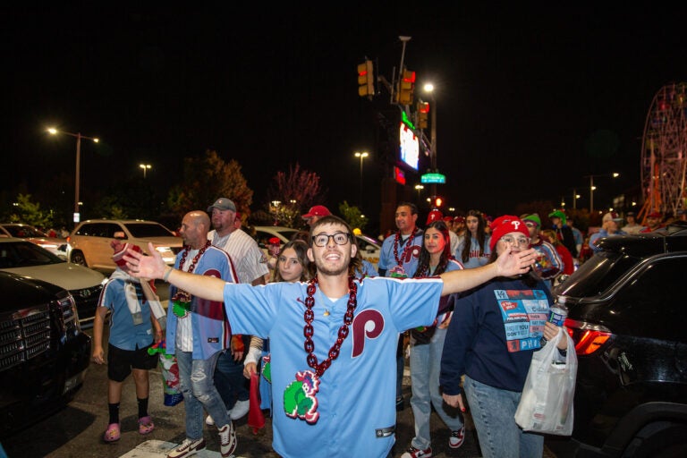 Fans celebrate as the Phillies clinch their spot in the NLCS, putting them one step closer to the World Series on October 12 2023 (Emily Cohen for WHYY)