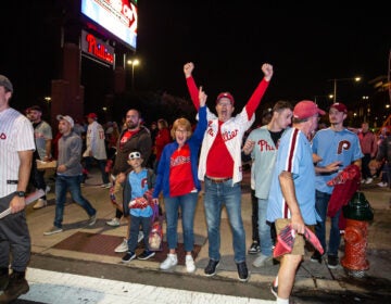 Fans celebrate as the Phillies clinch their spot in the NLCS, putting them one step closer to the World Series on October 12 2023 (Emily Cohen for WHYY)