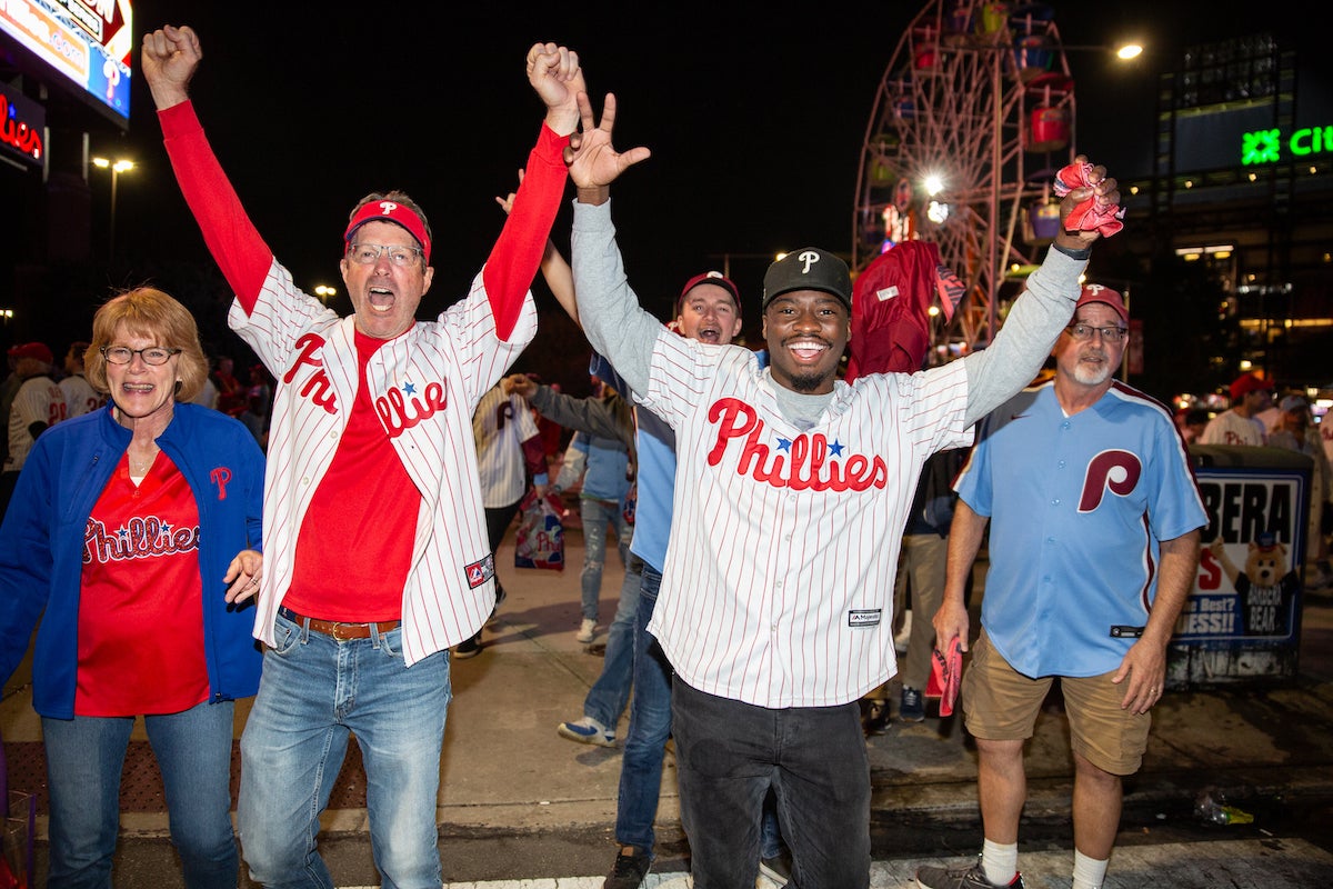Fans celebrate as the Phillies clinch their spot in the NLCS
