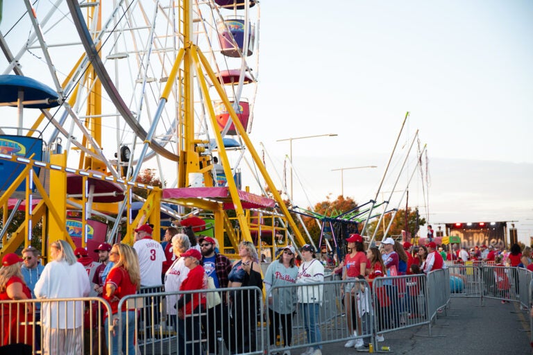 Fans of all ages enjoy the Citzens Bank Park fan tailgate before heading into Game 4 of the Phillies playoff series game on October 12 2023. (Emily Cohen for WHYY)