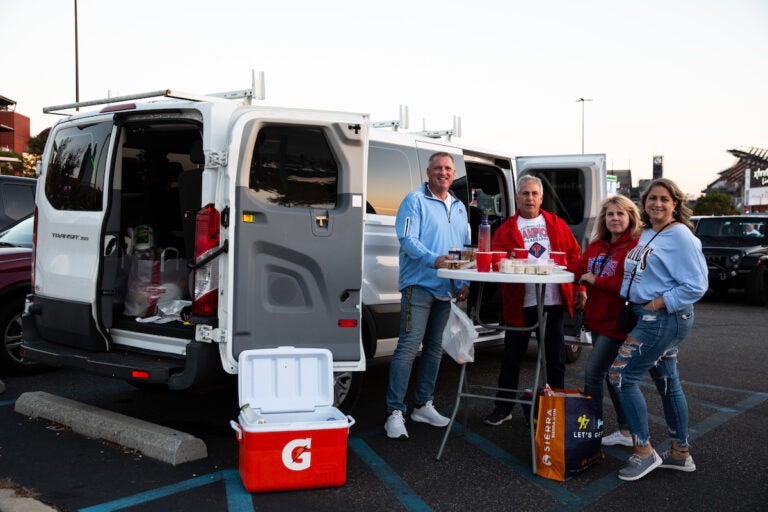 Scott Grau, Paul Menta, Mary Menta, and Michelle Nives (Left to Right) came from West Chester to taligate for Game 4 of the Phillies playoff series game on October 12 2023. (Emily Cohen for WHYY)