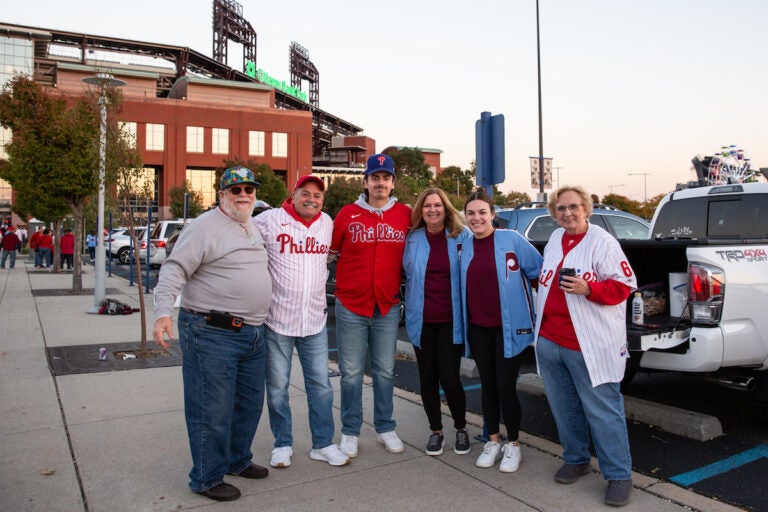 The DeLuca and Gobel families tailgate together for Game 4 of the Phillies playoff series game on October 12 2023. (Emily Cohen for WHYY)