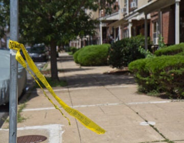 broken police tape at a crime scene.