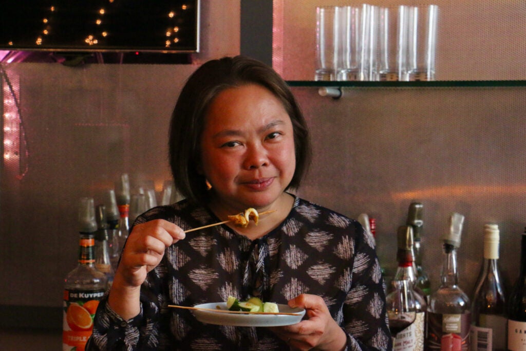 Chef Ange Branca samples the aorta saté (beef) with peanut sauce