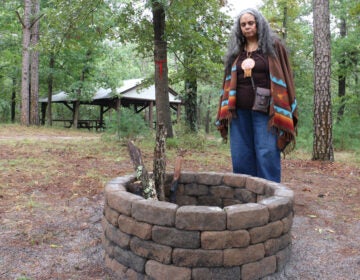 Tyrese Gould Jacinto looks into a fire circle