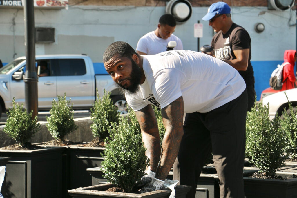 Nickeem Higgins working with a planter