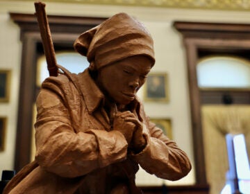 The hands of Alvin Pettit's Harriet Tubman statue are folded in prayer, or perhaps clenched. (Emma Lee/WHYY)