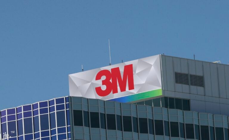 A sign on top of a building reads 3M.