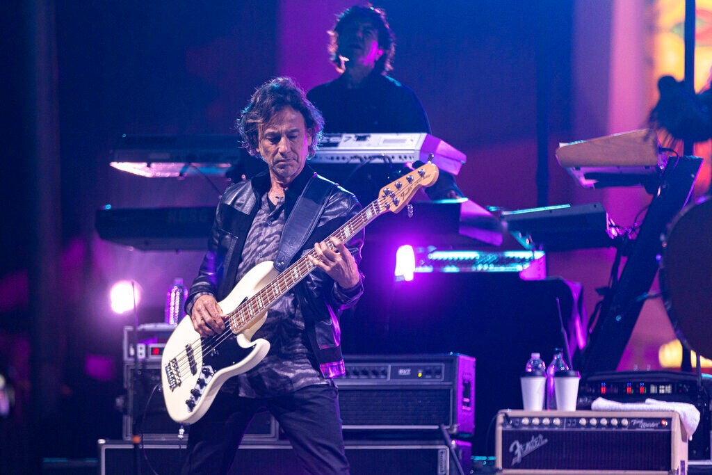 Juan Calleros plays guitar onstage