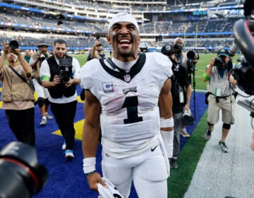 Philadelphia Eagles quarterback Jalen Hurts celebrates after the Eagles defeated the Los Angeles Rams 23-14 in an NFL football game Sunday, Oct. 8, 2023, in Inglewood, Calif.