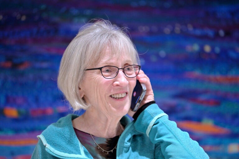 Claudia Goldin speaks to a reporter on the phone in her home in Cambridge, Mass. after learning that she received the Nobel Prize in Economics, Monday, Oct. 9, 2023.