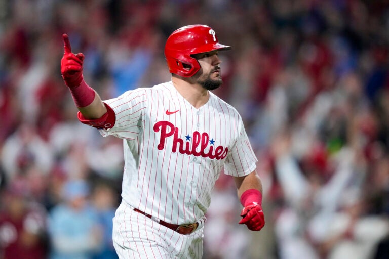 Kyle Schwarber celebrates after hitting a home run