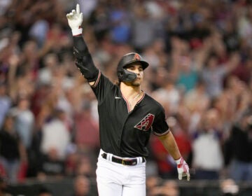 Arizona Diamondbacks' Alek Thomas raises his hand up after hitting a home run