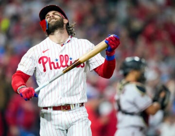 Philadelphia Phillies' Bryce Harper reacts after flying out to end the fifth inning against the Arizona Diamondbacks in Game 7 of the baseball NL Championship Series in Philadelphia Tuesday, Oct. 24, 2023. (AP Photo/Matt Slocum)