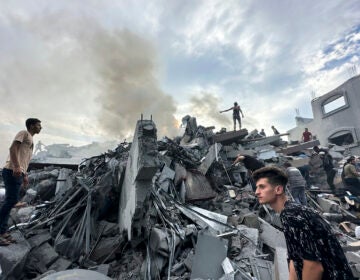 Palestinians look for survivors following Israeli airstrike in Nusseirat refugee camp, Gaza Strip, Tuesday, Oct. 31, 2023. (AP Photo/Doaa AlBaz)