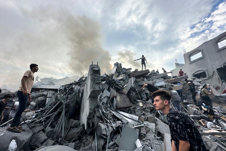 Palestinians look for survivors following Israeli airstrike in Nusseirat refugee camp, Gaza Strip, Tuesday, Oct. 31, 2023. (AP Photo/Doaa AlBaz)