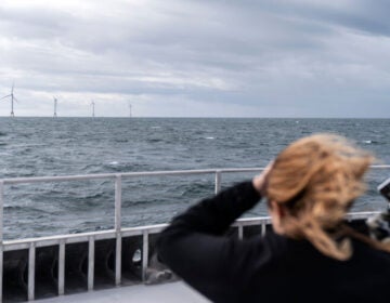 Guests tour the five turbines of America's first offshore wind farm, owned by the Danish company, Ørsted, off the coast of Block Island, R.I. Ørsted is being sued over its Ocean Wind 1 project, New Jersey’s first offshore wind farm.