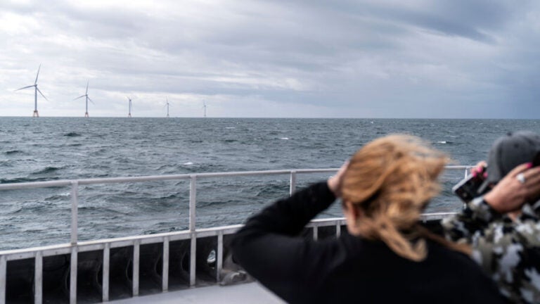 Guests tour the five turbines of America's first offshore wind farm, owned by the Danish company, Ørsted, off the coast of Block Island, R.I. Ørsted is being sued over its Ocean Wind 1 project, New Jersey’s first offshore wind farm.