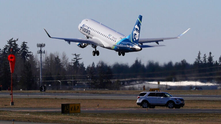 An Alaska Airlines Embraer 175 jet, similar to this one, was forced to make an unexpected landing Sunday night after an off-duty pilot who was riding in the cockpit allegedly attempted to disable the aircraft's engines. Ted S. Warren/AP