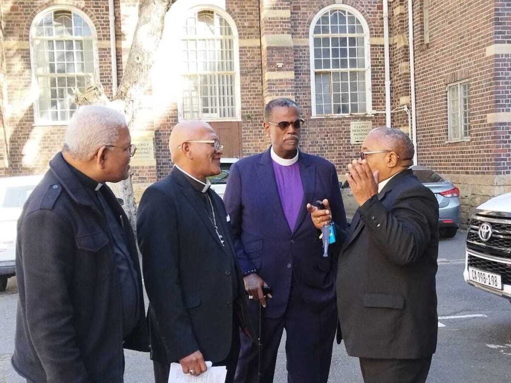 Bishop Beaman meets with congregants in Africa.