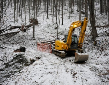 A digging construction machine in the woods