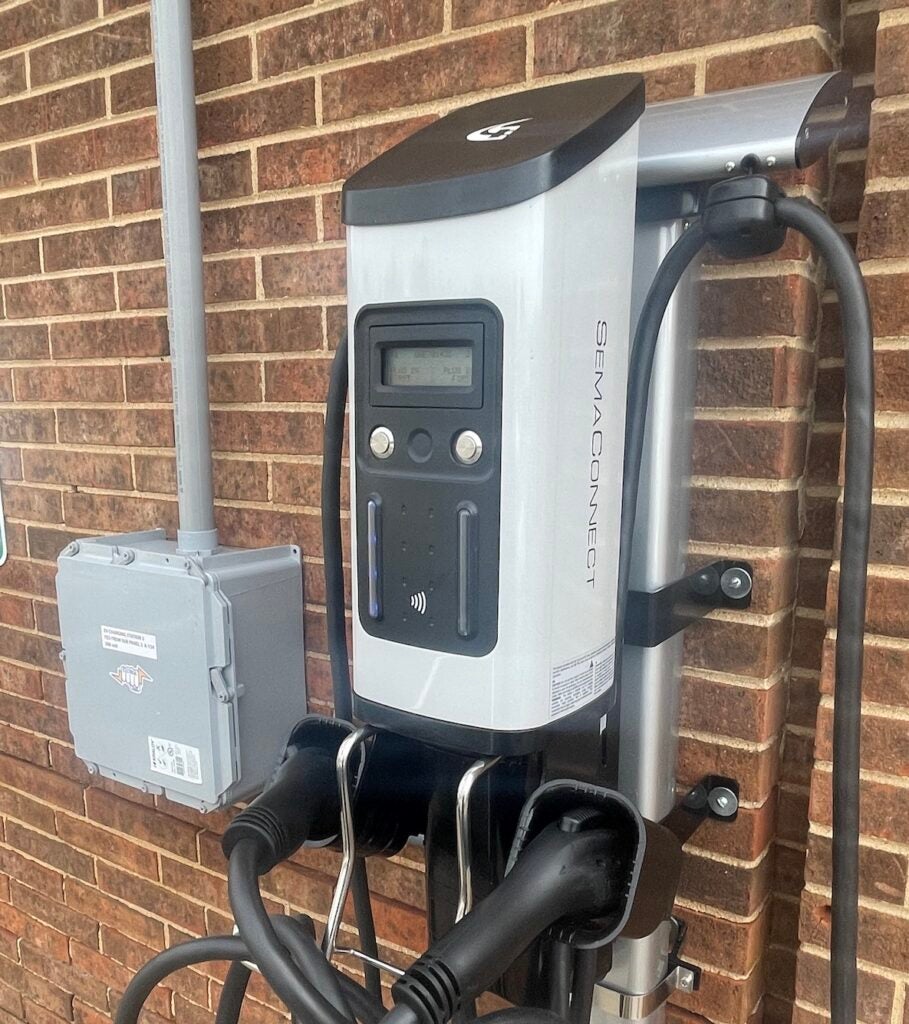 A close-up of an EV charging station